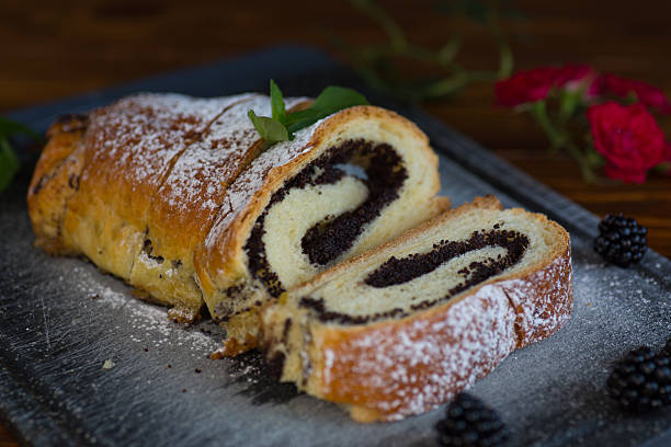 istock Homemade poppy seed roll with powdered sugar on a tray 2240399584