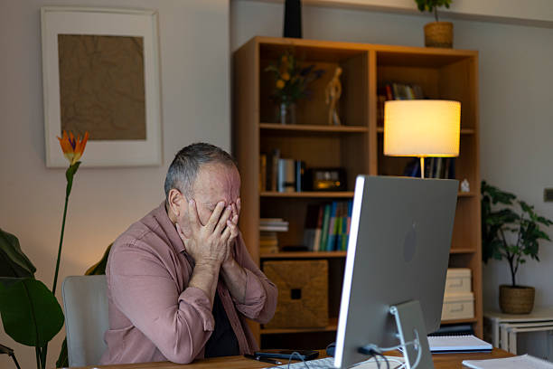 istock Stressed mid adult man working from home experiencing burnout 2240401213