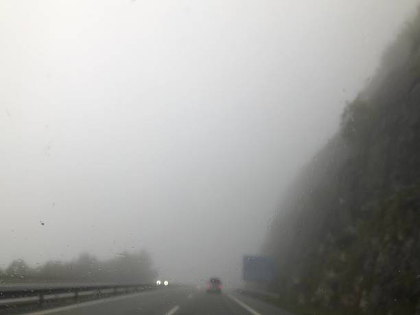 istock Foggy Highway Drive in Misty Weather 2240404247