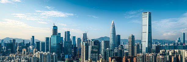 istock Modern central business district skyline with skyscrapers under construction on a clear sunny day in Shenzhen, China. 2240404446