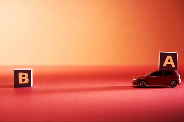 Two toy cars on a pink background during a play session with friends in a simple setting