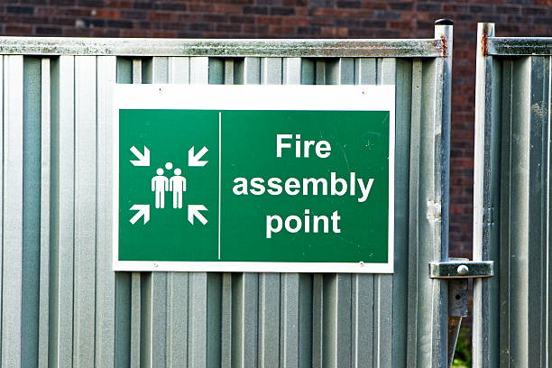 istock Fire assembly point sign at workplace signpost 2240413619
