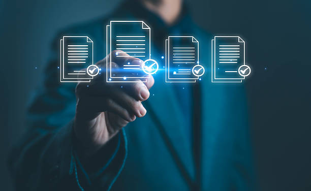 istock Businessman touching virtual document icons with check marks representing digital approval online data management electronic document verification and business workflow automation in modern technology 2240417519