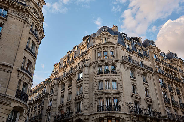 istock Paris haussmannian architecture building facade with blue sky 2240423201