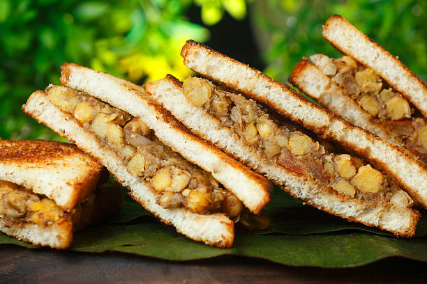 Crispy toasted bread stuffed with spicy chickpea (chole) filling, served fresh and flavorful.