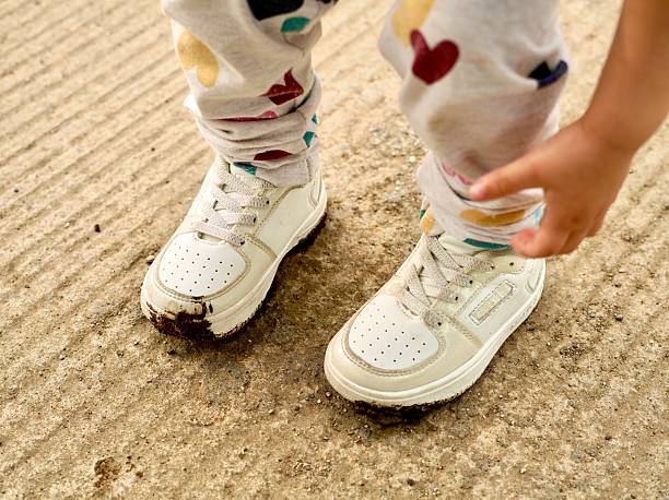 istock Child shoes with mud 2240435485