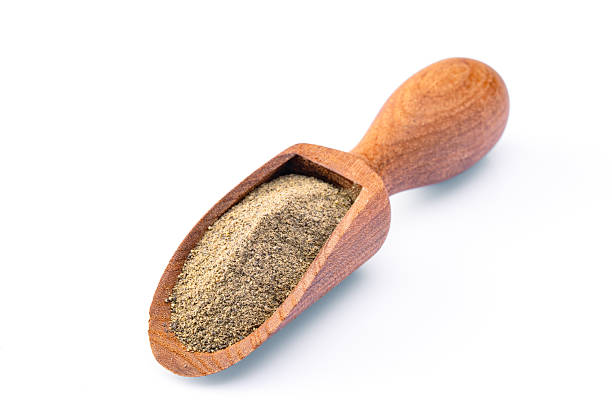 istock Ground black pepper powder on white background 2240436514