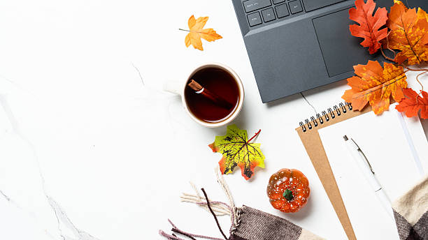 istock Laptop, notebook, coffee cup and yellow leaves. 2240441027