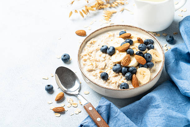 istock Oatmeal porridge with bananas, nuts and blueberries. 2240442400