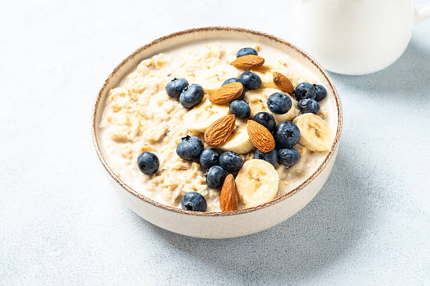 istock Oatmeal porridge with bananas, nuts and blueberries. 2240443044