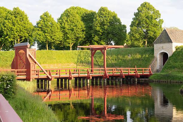 Chesapeake, Virginia, USA - April 12, 2024: A single Bascule type bridge carries traffic on Battlefield Boulevard over the Intracoastal Waterway.