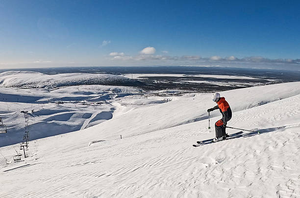Beautiful cold mountain view of ski resort, winter day with slope, piste and ski lift, sunny day