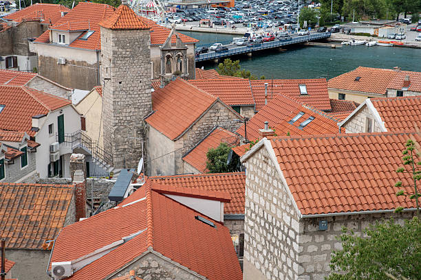 Terracotta rooftops above old stone houses