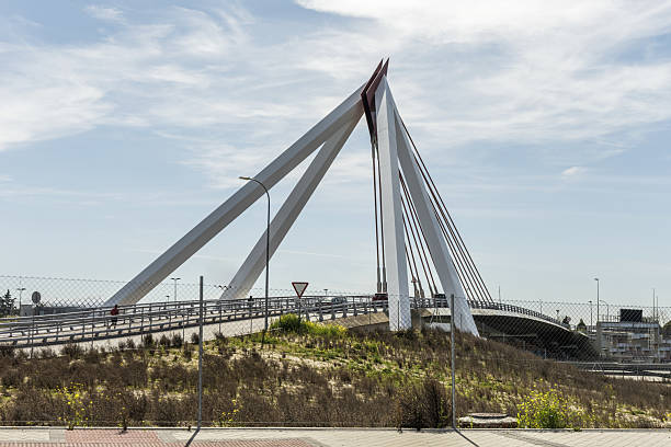 istock small suspension bridge with metal structure over a highway 2240451879