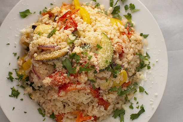 istock Delicious Couscous Salad Prepared with Fresh Vegetables and Herbs 2240452273