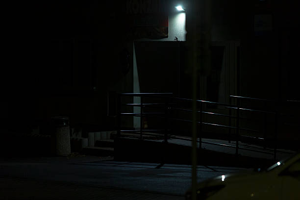 istock A dimly lit entrance featuring a ramp is set within a nighttime environment 2240466281