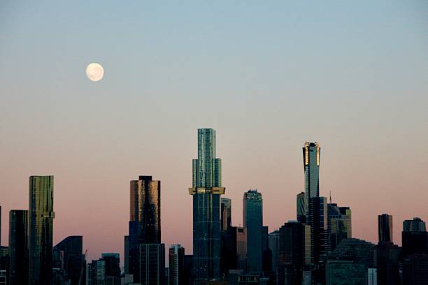Melbourne skyline with a full moon at dusk