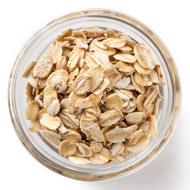 istock Bowl of Rolled Oats on White Background 2240475743