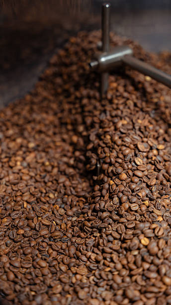 istock Roasting coffee beans mixing in industrial machine 2240477420