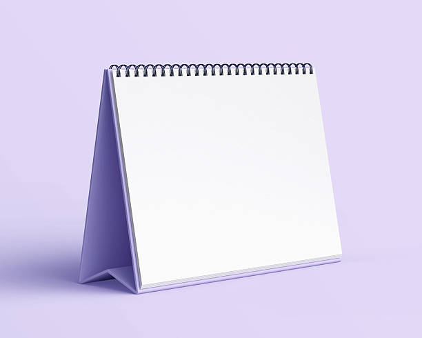 istock Blank desk calendar mockup on light purple background. 2240478737