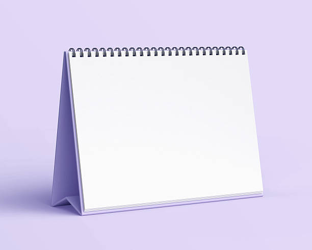 istock Blank desk calendar mockup on light purple background. 2240478779