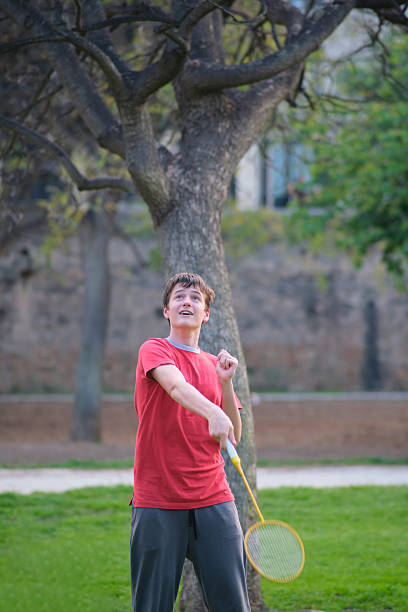 istock A boy plays badminton outdoor 2240479873