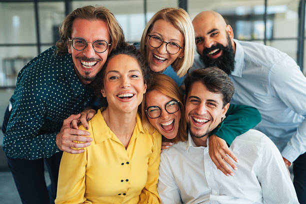 istock Business team embracing after achieving goals 2240483043