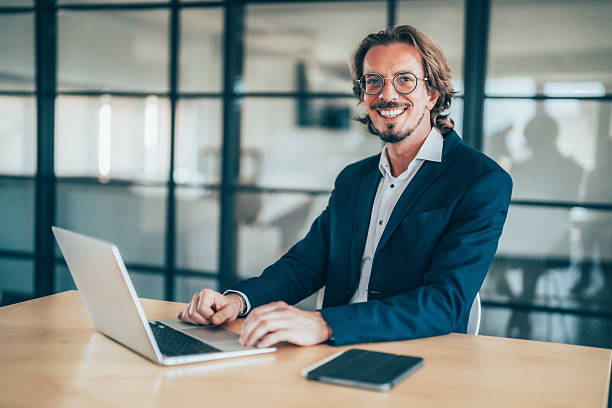 istock Successful professional typing on laptop, working intently at sleek workspace with focused expression and confident demeanor 2240483046