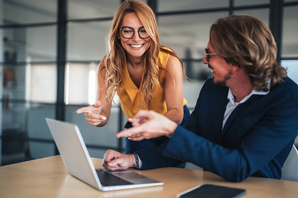 istock Business colleagues communicating and collaborating in an office 2240483049