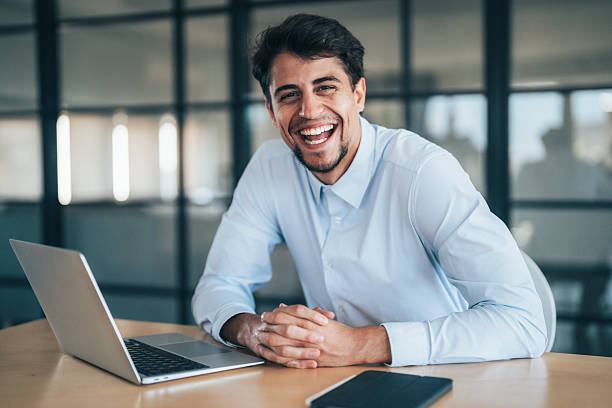 istock Confident young businessman managing work online 2240483053