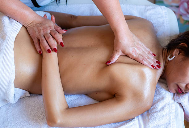 istock Woman enjoying relaxing back massage at spa 2240486058