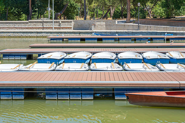 The pier as a metaphor: still boats and moving ducks, reminding us that life flows