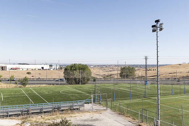 istock Several grass soccer training fields for youth and children's teams with lamp posts for lighting 2240486318