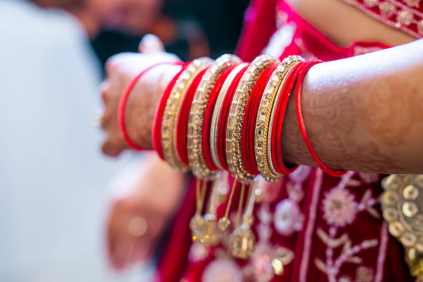 istock Indian bride’s traditional wedding bangles close up 2240486441