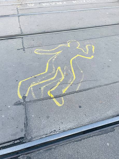 istock Chalk Outline on Sidewalk Depicting a Human Figure or Shape Clearly 2240491120