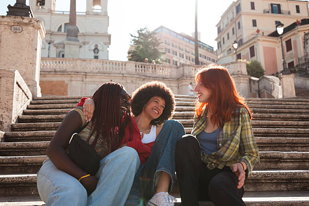 istock Young multicultural friends enjoying time at the Spanish Steps in Rome 2240493886