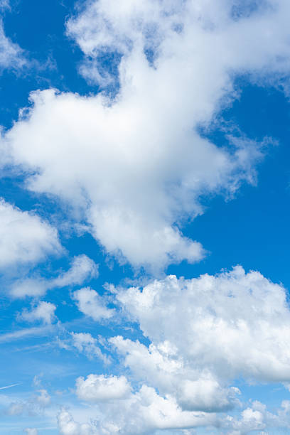 istock Vibrant blue sky filled with large fluffy white cumulus clouds and wispy cirrus formations 2240501327