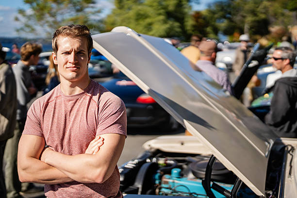 istock Man Standing by Muscle Car at Meetup 2240513288