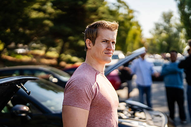 istock Man Standing by Muscle Car at Meetup 2240513298