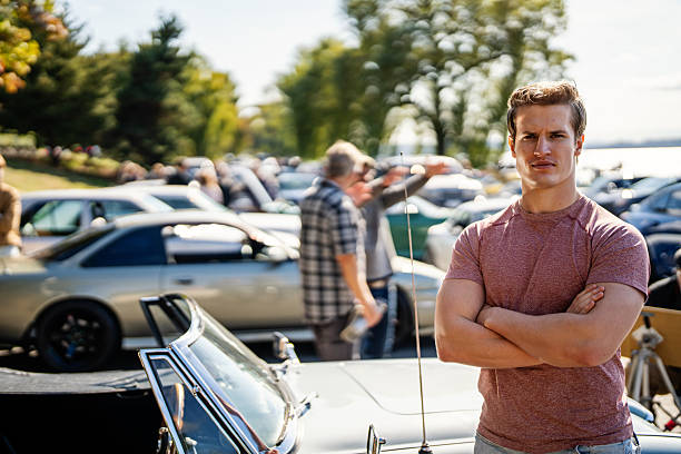 istock Man Standing by Muscle Car at Meetup 2240513303