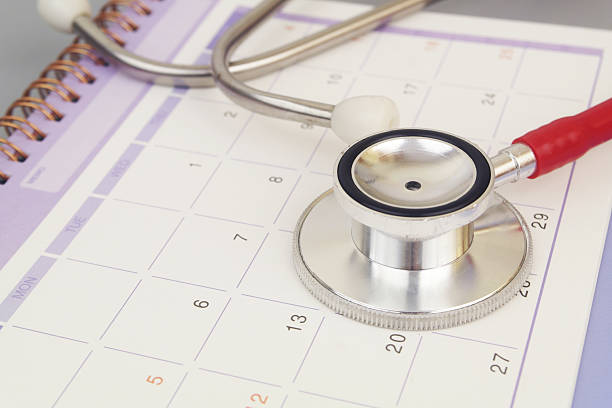 istock Stethoscope on calendar page close up. 2240522804