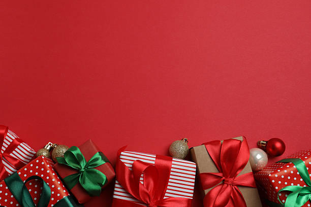 istock many red gift boxes with ribbons and christmas balls. flat lay 2240528287