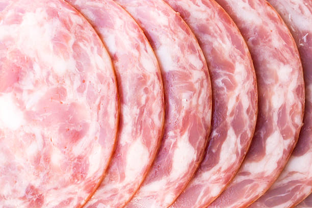 Close-up of a pink delicious ham. sliced pieces layout