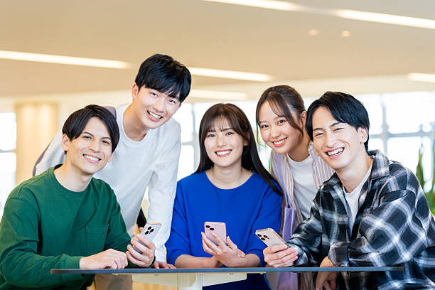 istock Male and female university students relaxing on campus 2240534553