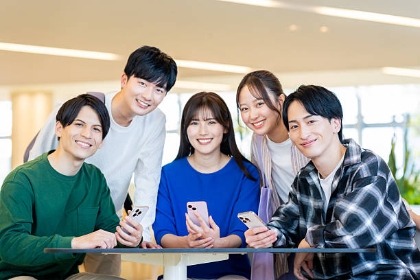 istock Male and female university students relaxing on campus 2240534555