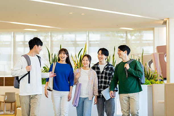 istock Male and female university students relaxing on campus 2240534577