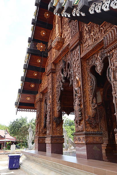 istock An ornate structure with intricate architectural detailing, characterized by what appears to be traditional Indian design elements such as carved patterns and dark woodwork 2240536142