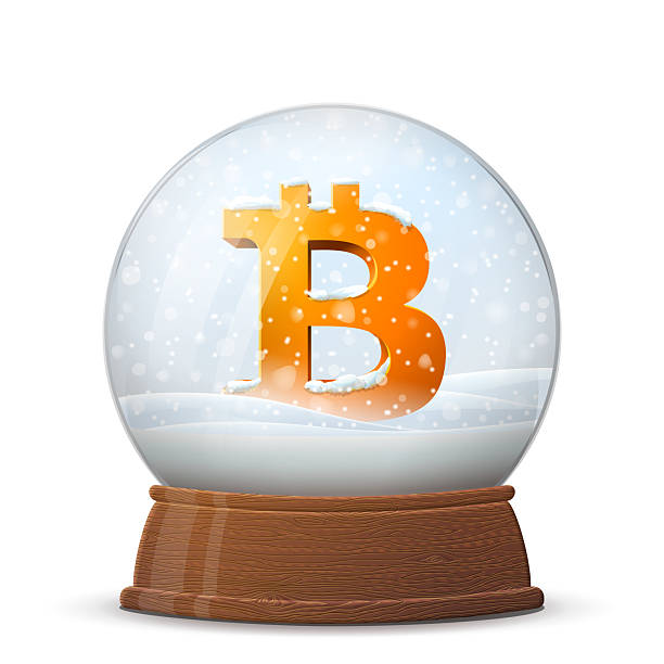 istock Christmas snow globe with bitcoin symbol on wooden stand 2240541305