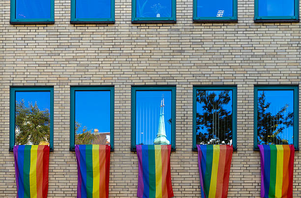 Rainbow flags on the windows of a building