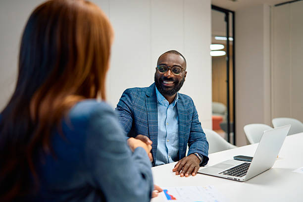 istock Business people shaking hands celebrating partnership in office 2240545067
